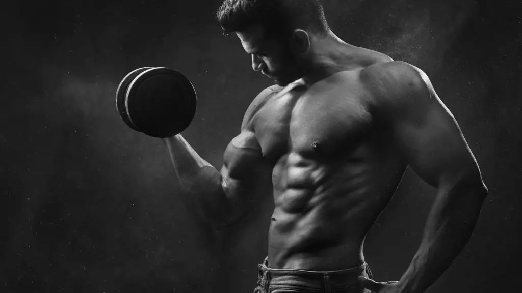 musclular man lifting weights